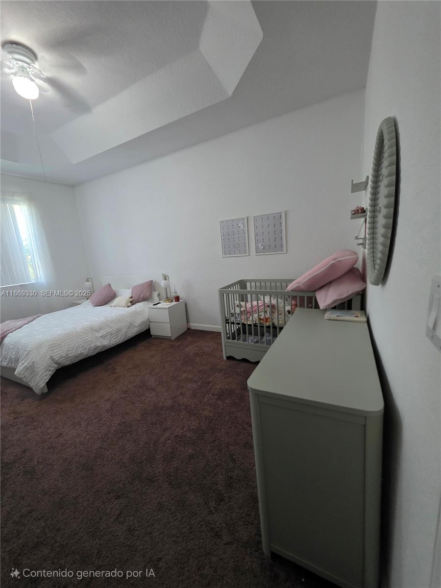13236 Southwest 128th Street Miami, FL 33186 - Photo 17 of 41 a bed room with a bed and a chair