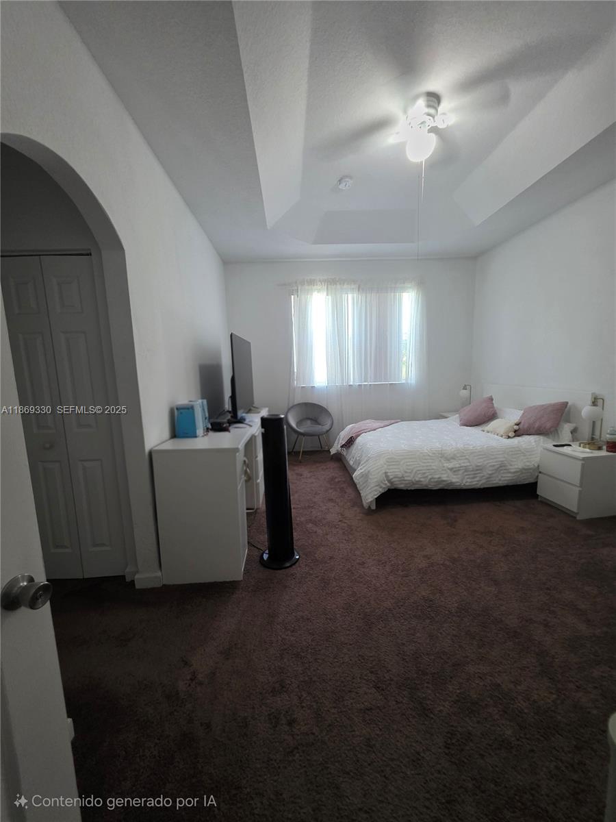 13236 Southwest 128th Street Miami, FL 33186 - Photo 18 of 41 a bed room with bed and window