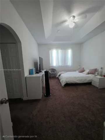 a bathroom with a double vanity sink a mirror and a bathtub