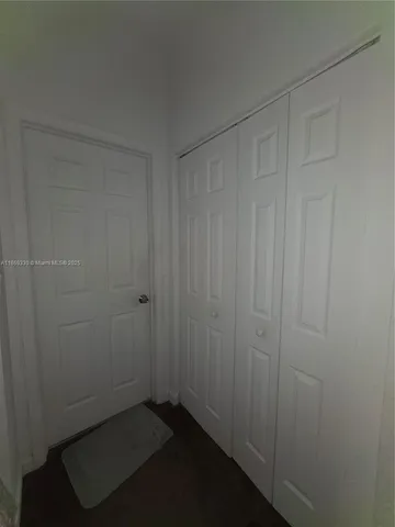 a view of hallway with closet