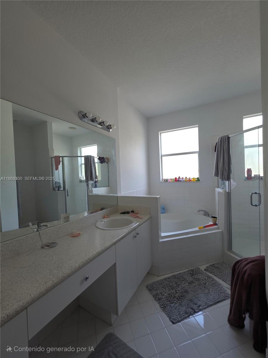 13236 Southwest 128th Street Miami, FL 33186 - Photo 21 of 41 a bathroom with a granite countertop sink and a mirror