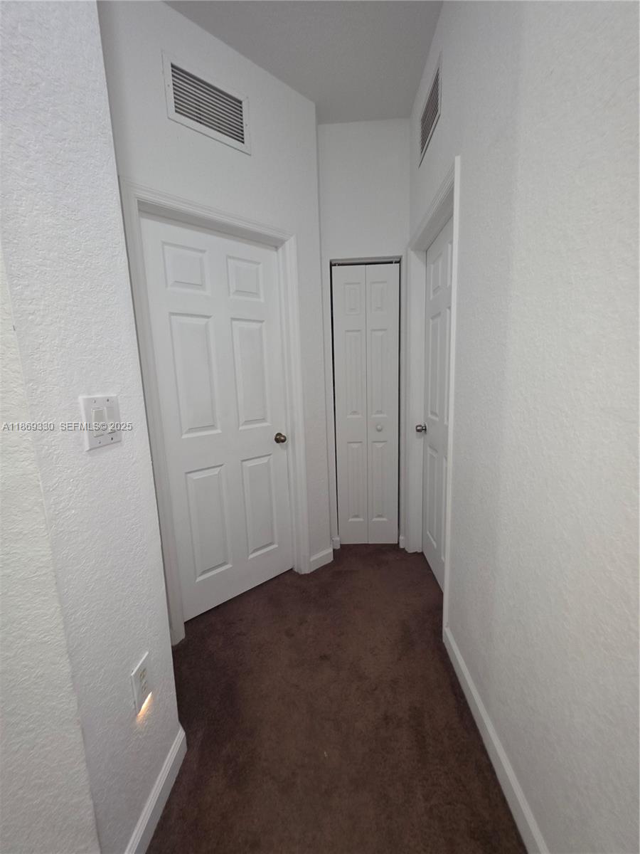 13236 Southwest 128th Street Miami, FL 33186 - Photo 23 of 41 a view of hallway with closet