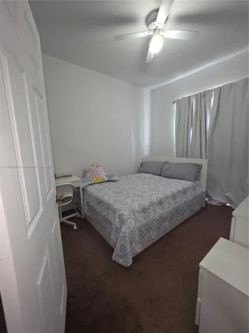 a view of a kitchen from the hallway