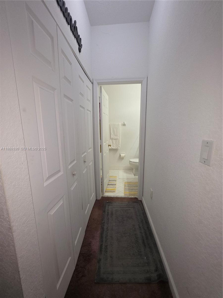 13236 Southwest 128th Street Miami, FL 33186 - Photo 29 of 41 a view of a bathroom from a hallway