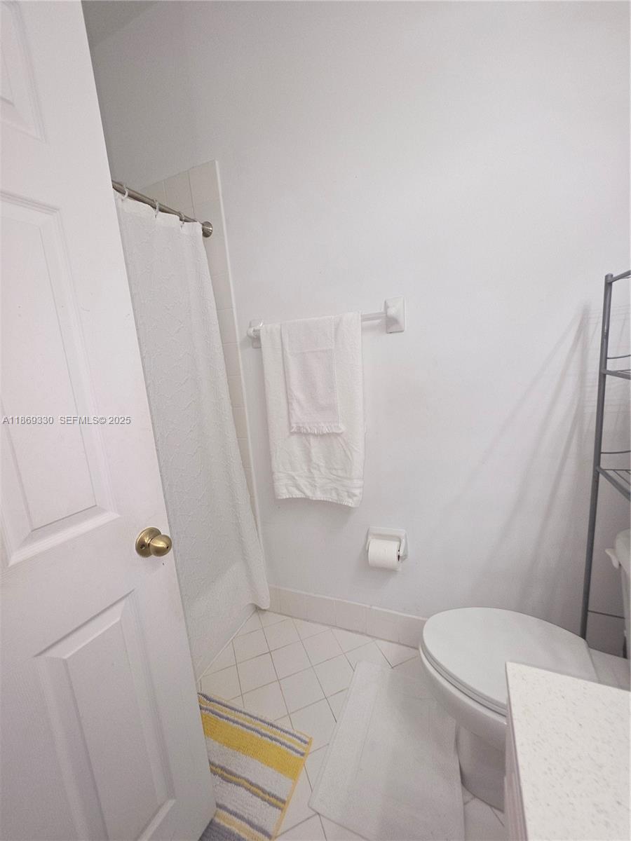 13236 Southwest 128th Street Miami, FL 33186 - Photo 30 of 41 a bathroom with a toilet and a shower
