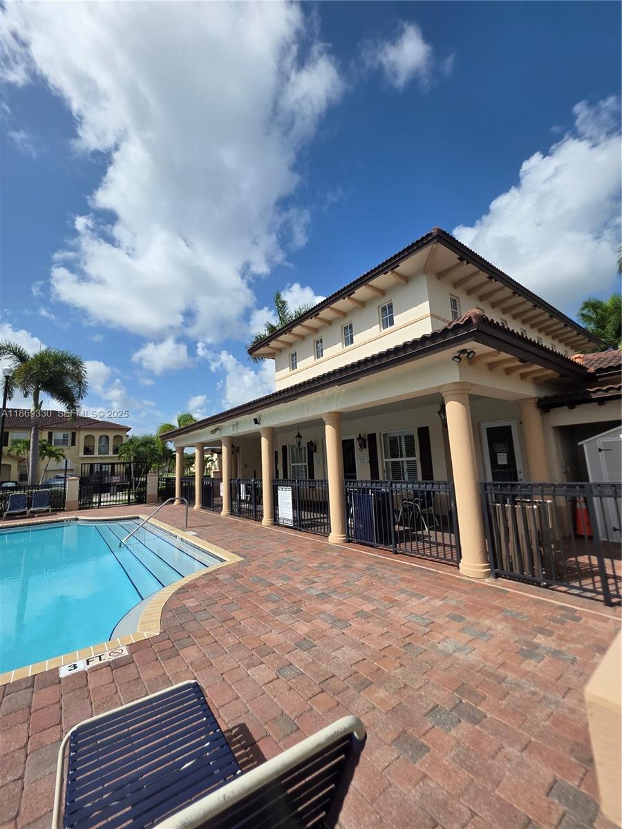 13236 Southwest 128th Street Miami, FL 33186 - Photo 38 of 41 a view of a house with a swimming pool and sitting area