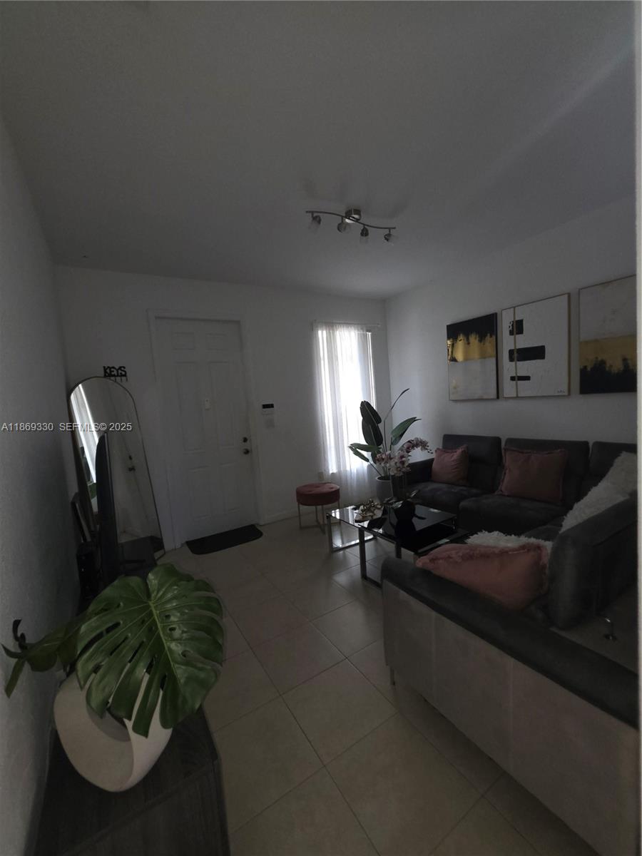 13236 Southwest 128th Street Miami, FL 33186 - Photo 5 of 41 a living room with furniture flowerpot and window