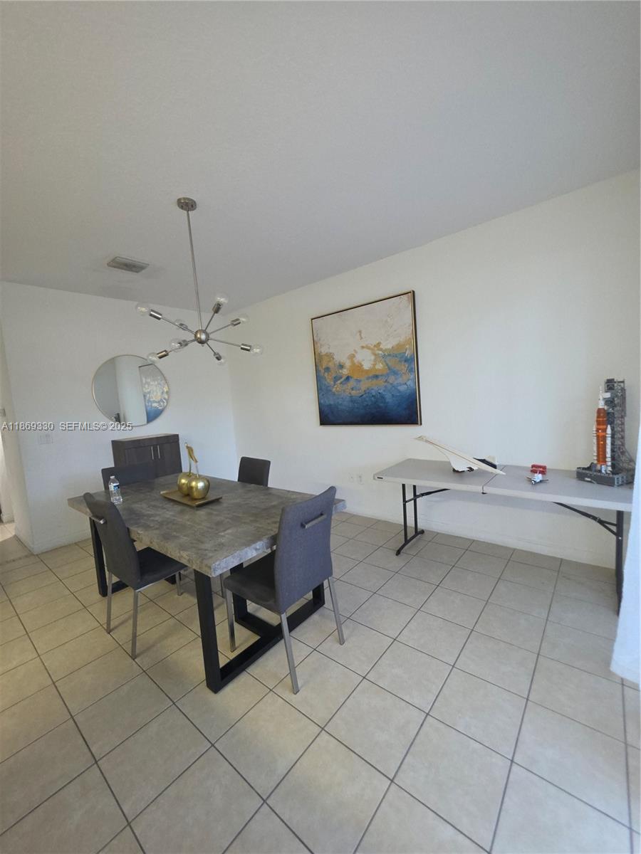 13236 Southwest 128th Street Miami, FL 33186 - Photo 10 of 41 a view of a workspace with furniture