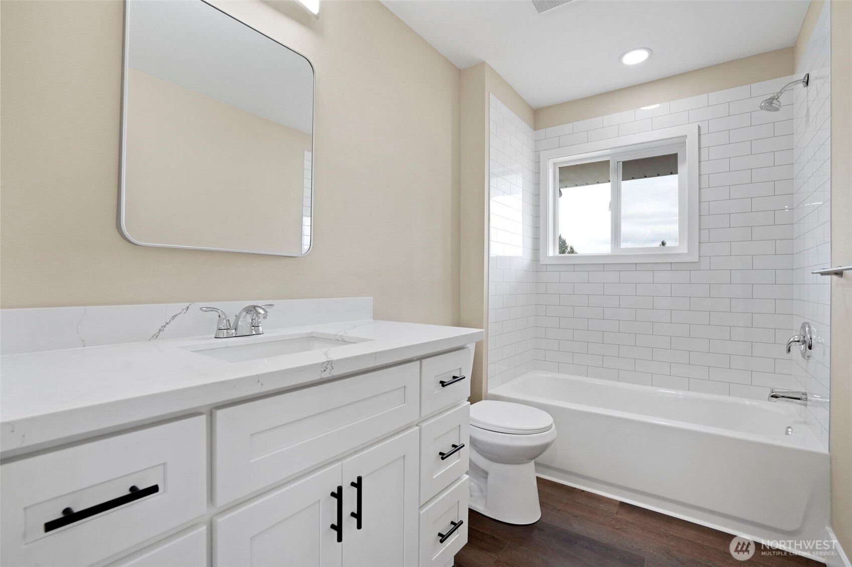 7804 280th Street South Roy, WA 98580 - Photo 23 of 33 a bathroom with a granite countertop toilet a sink and a bathtub
