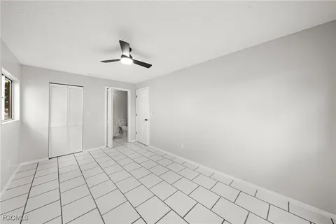 a view of an empty room and a window