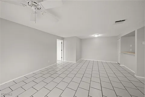 a room with a sink and a mirror