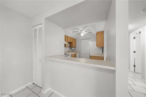 a kitchen with a sink cabinets and a refrigerator