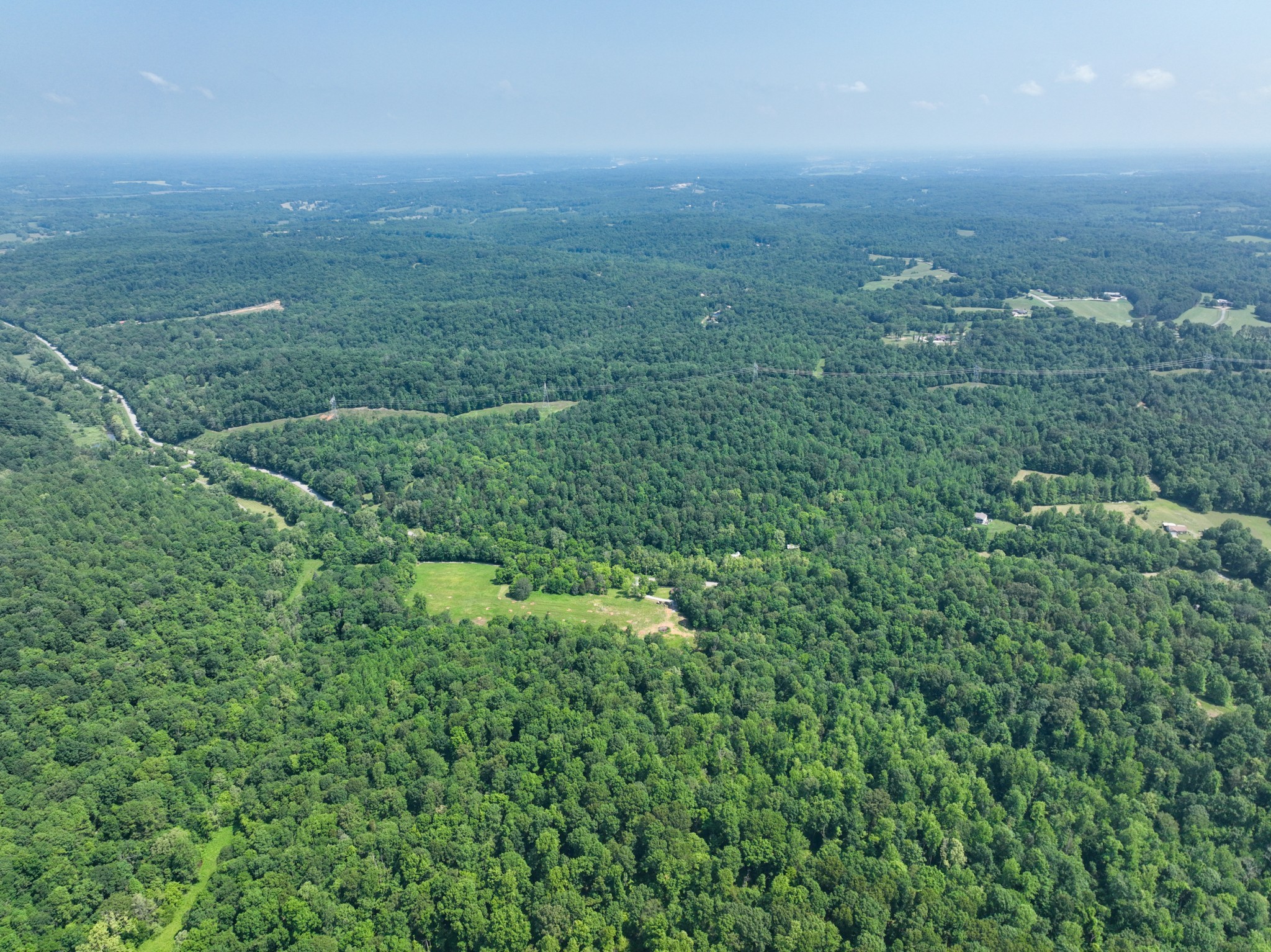 3846 Vernon Creek Road Cunningham, TN 37052 - Photo 9 of 10 an aerial view of residential houses with outdoor space and trees