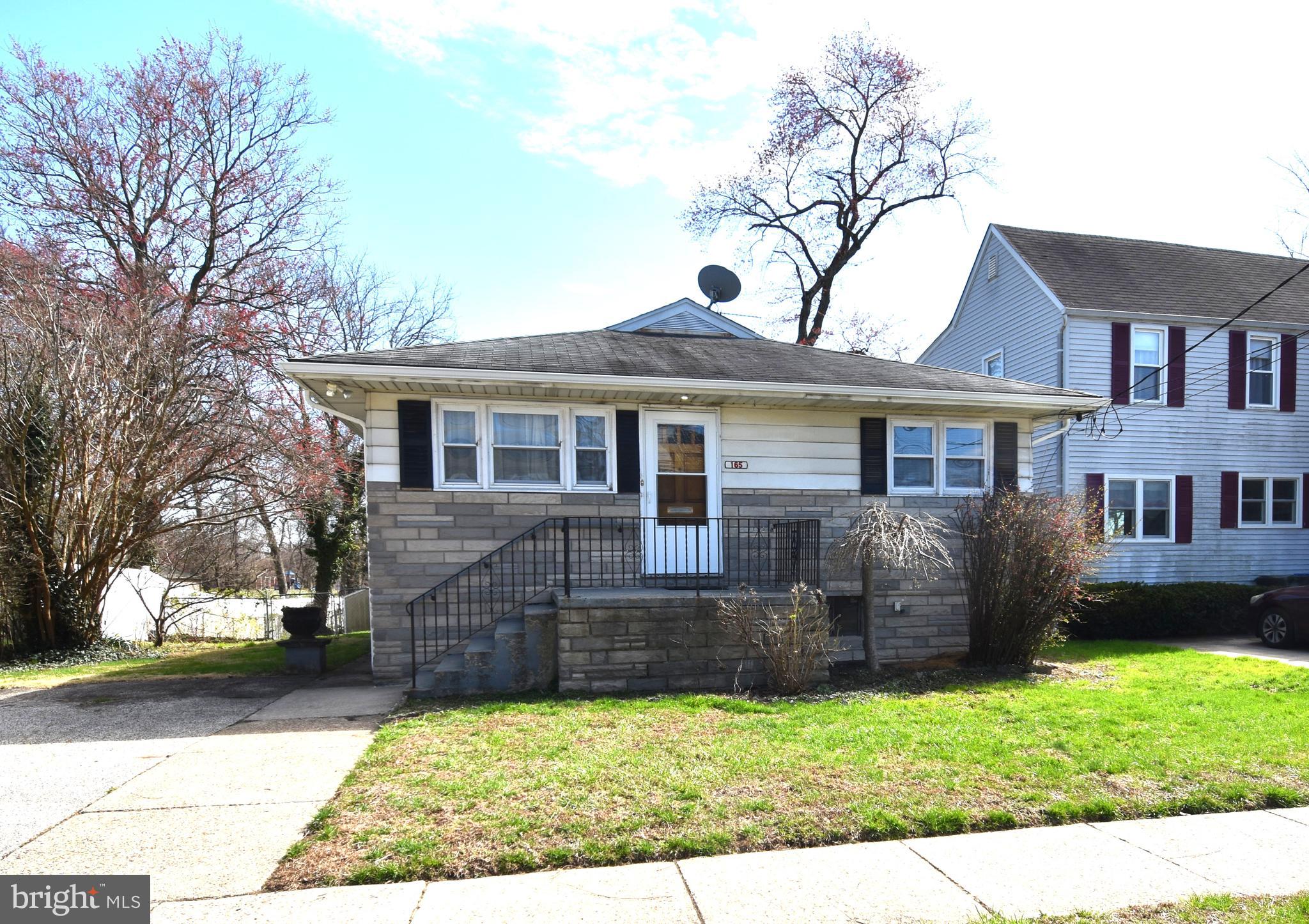 165 West Federal Street Burlington, NJ 08016 - Photo 1 of 27 a front view of a house with a yard