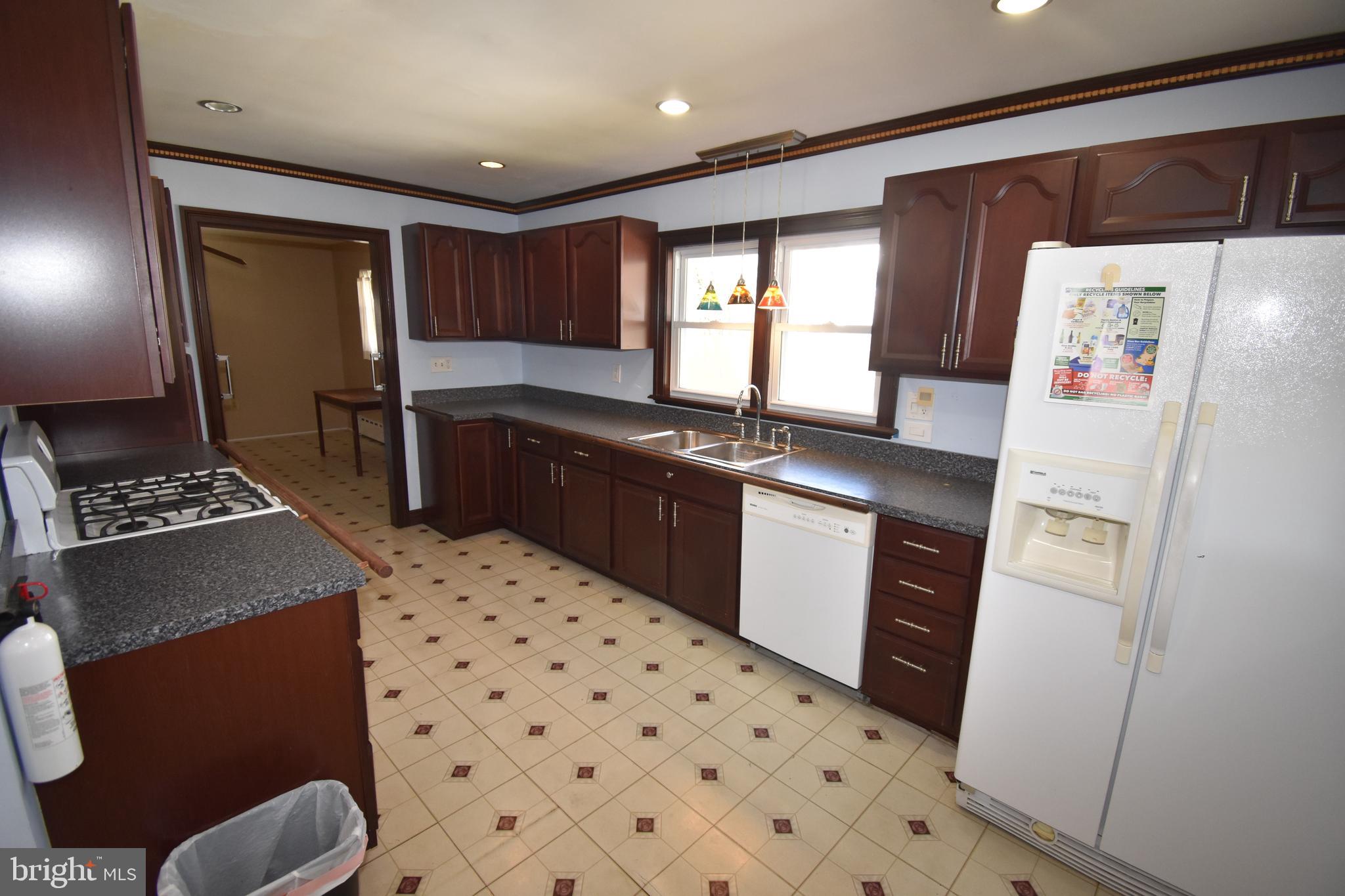 165 West Federal Street Burlington, NJ 08016 - Photo 15 of 27 a kitchen with stainless steel appliances a refrigerator and a stove