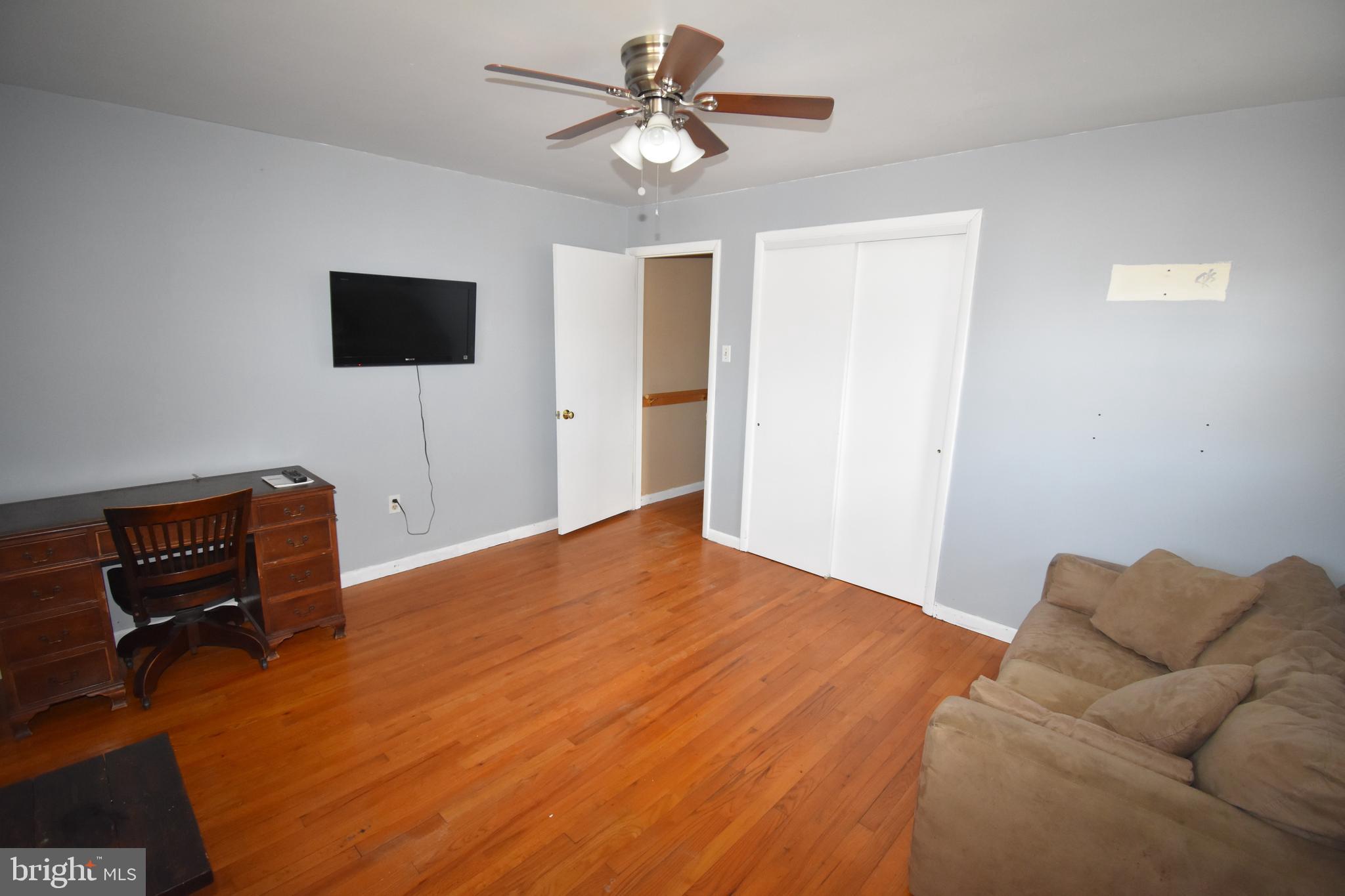 165 West Federal Street Burlington, NJ 08016 - Photo 19 of 27 a bedroom with a bed and a couch