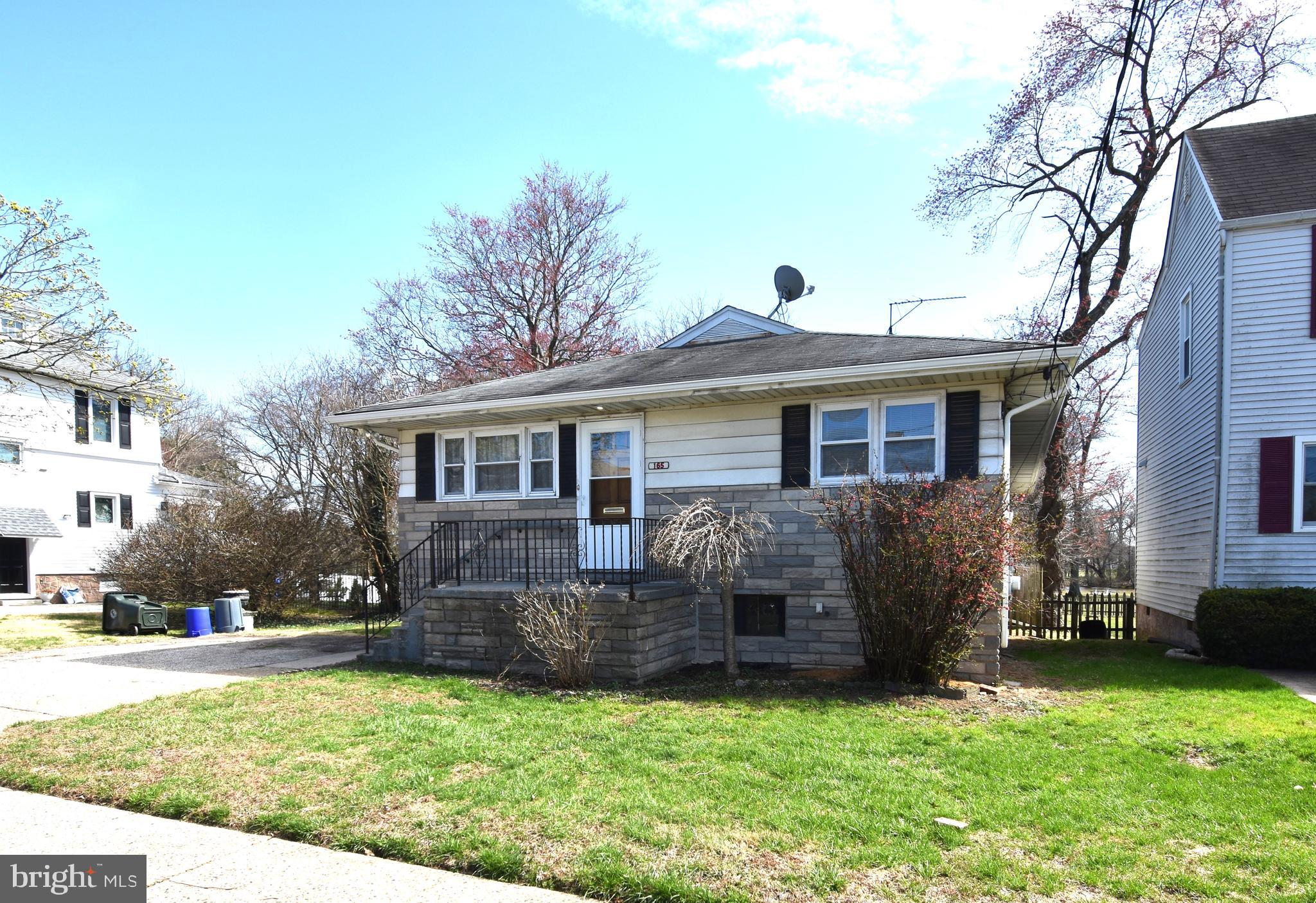 165 West Federal Street Burlington, NJ 08016 - Photo 2 of 27 a front view of a house with a yard and trees