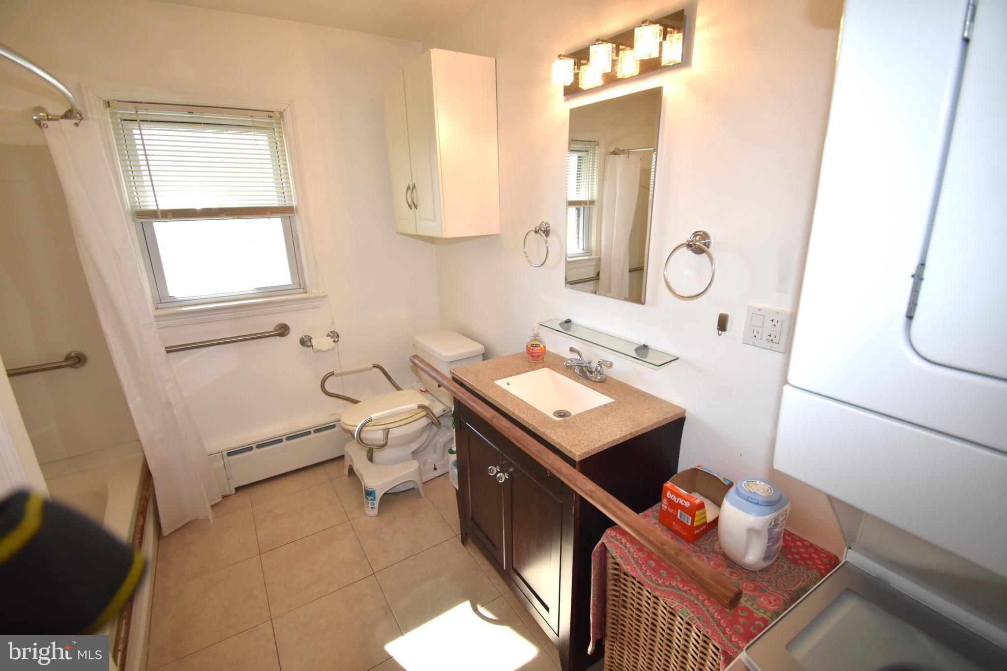 165 West Federal Street Burlington, NJ 08016 - Photo 23 of 27 a bathroom with a sink mirror vanity and toilet