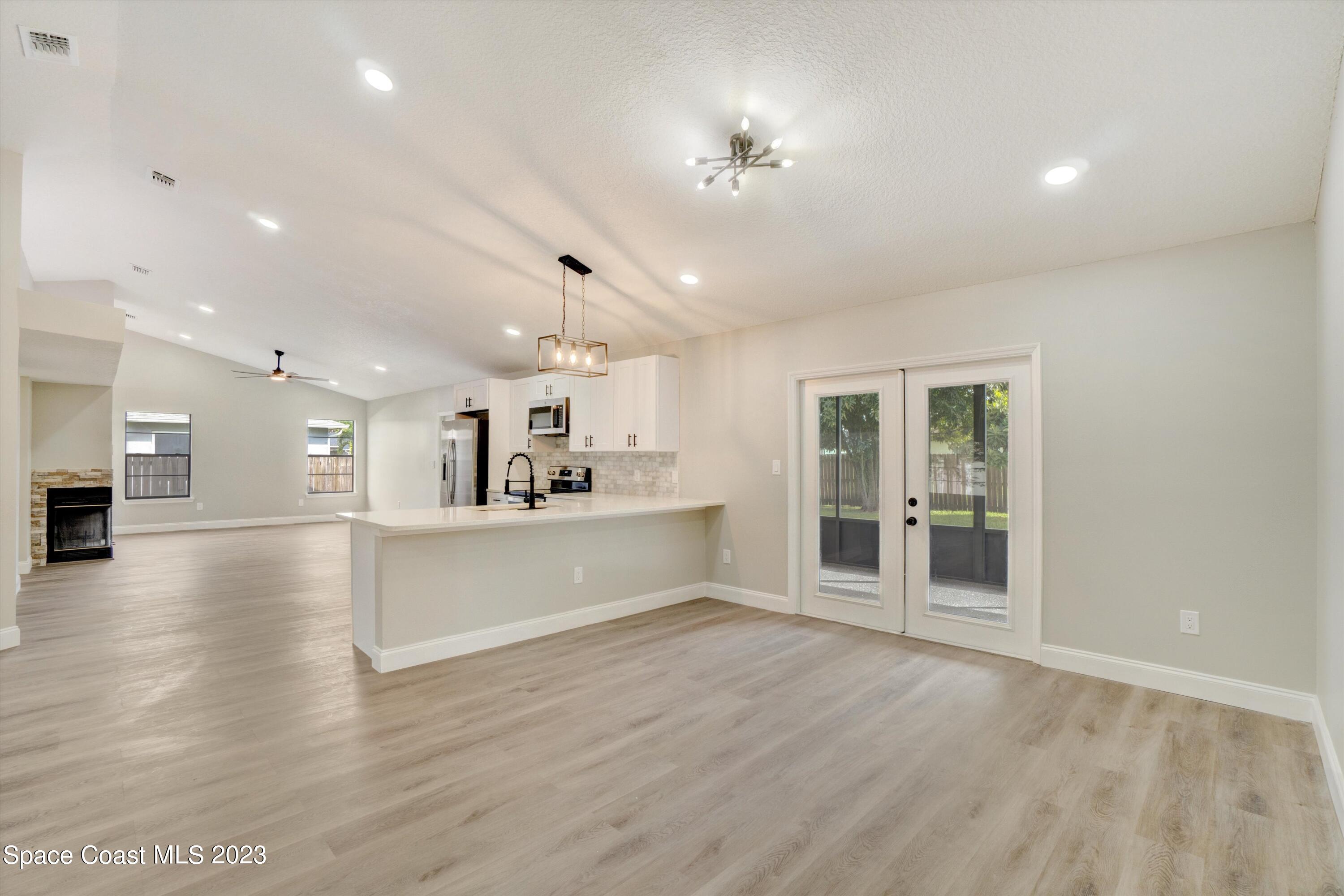 207 Eldron Boulevard Southeast Palm Bay, FL 32909 - Photo 12 of 60 a view of a kitchen with a sink and a large window