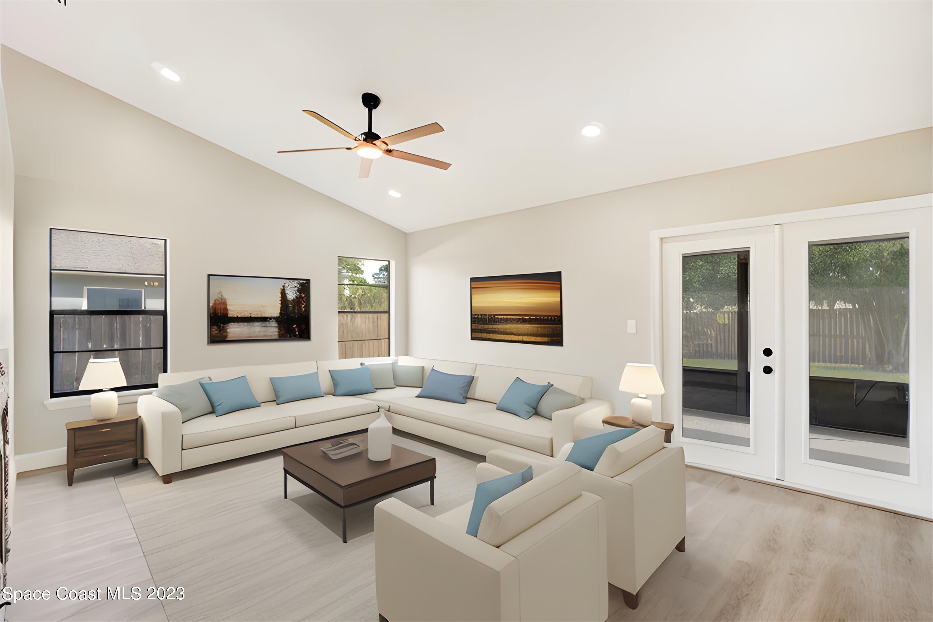 207 Eldron Boulevard Southeast Palm Bay, FL 32909 - Photo 18 of 60 a living room with furniture and a wooden floor