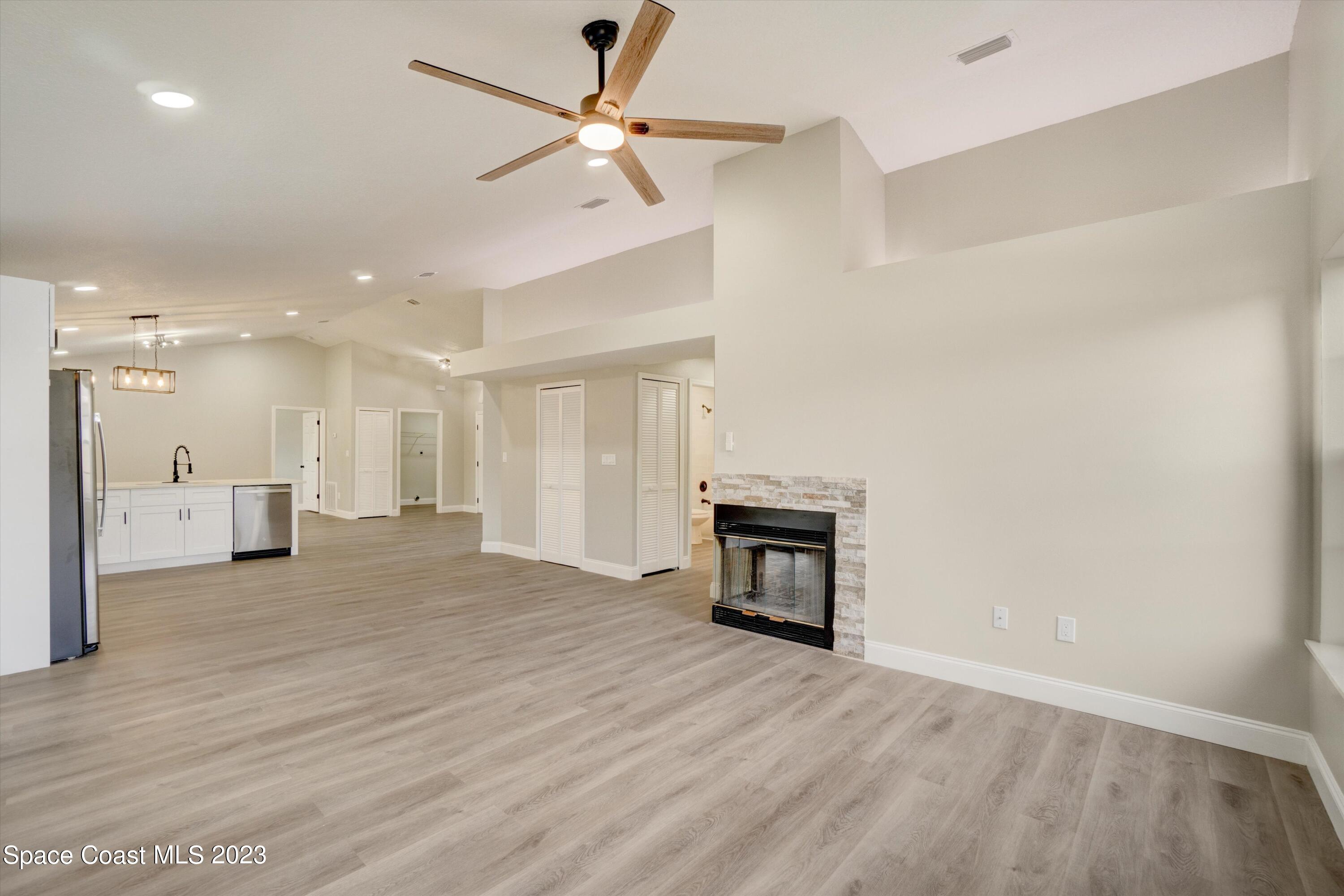 207 Eldron Boulevard Southeast Palm Bay, FL 32909 - Photo 20 of 60 a view of a livingroom with a fireplace