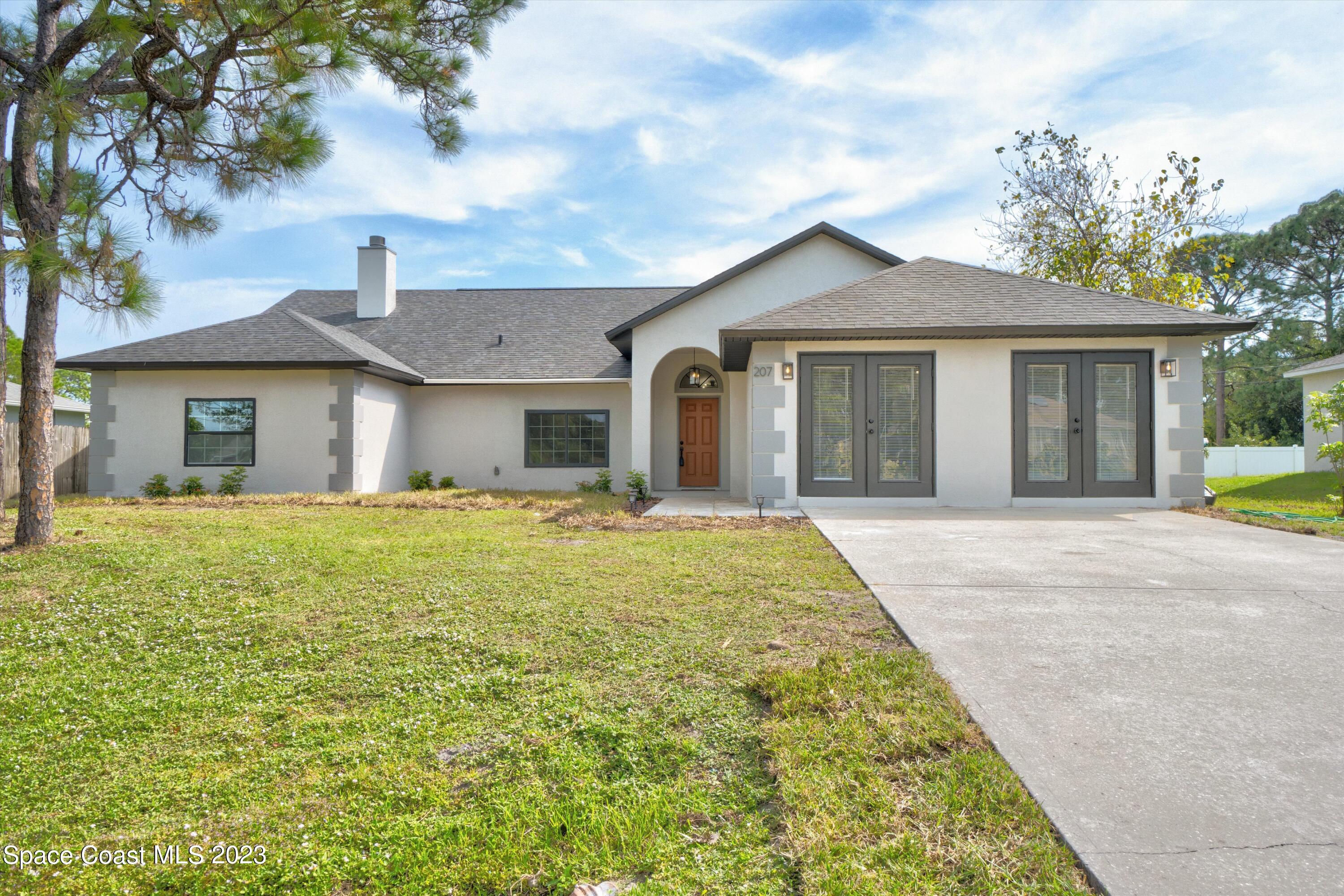 207 Eldron Boulevard Southeast Palm Bay, FL 32909 - Photo 2 of 60 01-207 Eldron Blvd SE-1