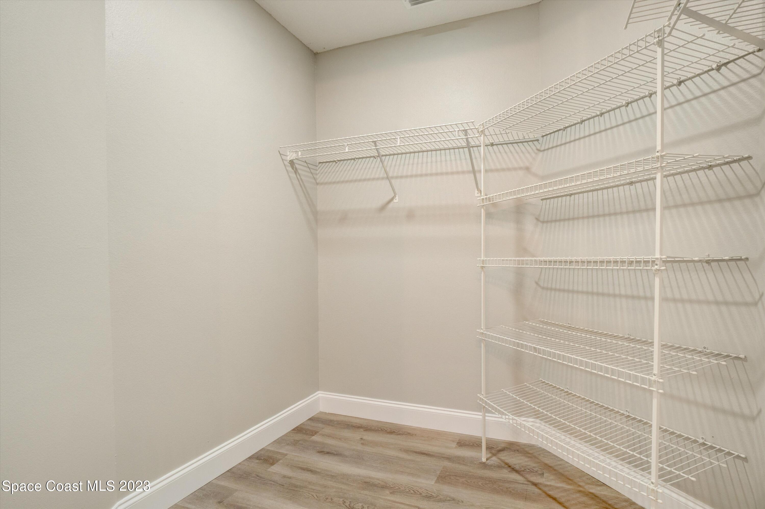 207 Eldron Boulevard Southeast Palm Bay, FL 32909 - Photo 30 of 60 a view of a room with empty racks