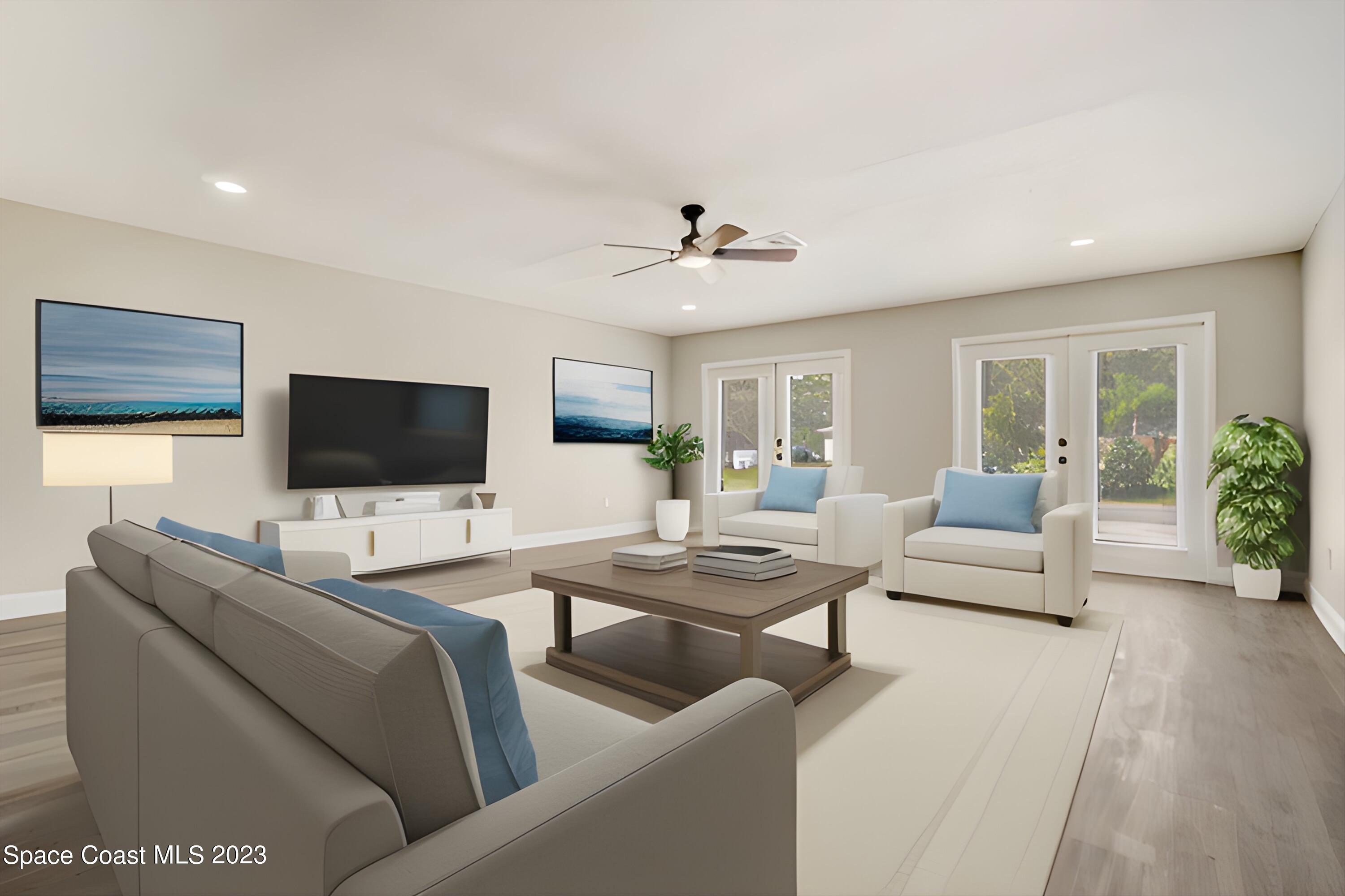 207 Eldron Boulevard Southeast Palm Bay, FL 32909 - Photo 32 of 60 a living room with furniture and a flat screen tv