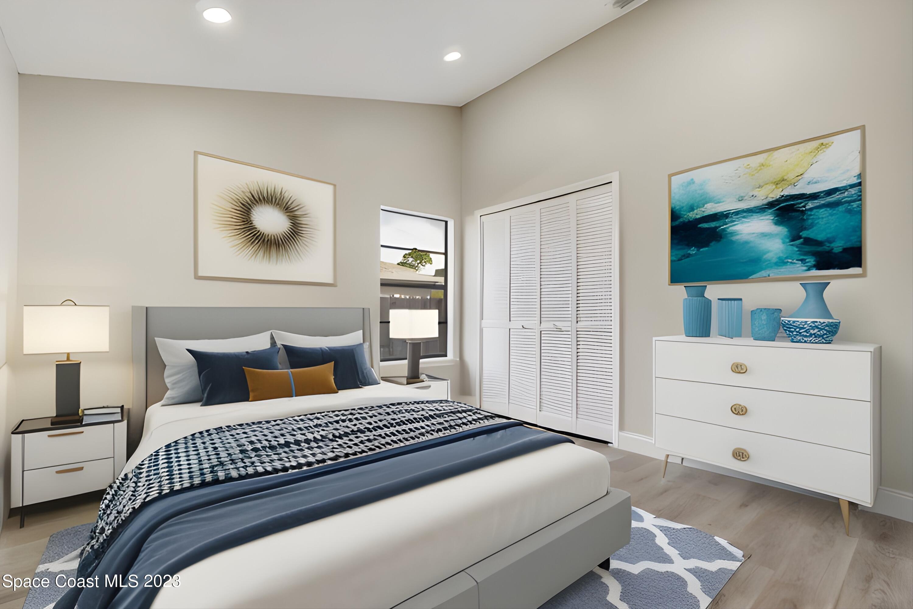 207 Eldron Boulevard Southeast Palm Bay, FL 32909 - Photo 37 of 60 a bedroom with a bed and a flat screen tv