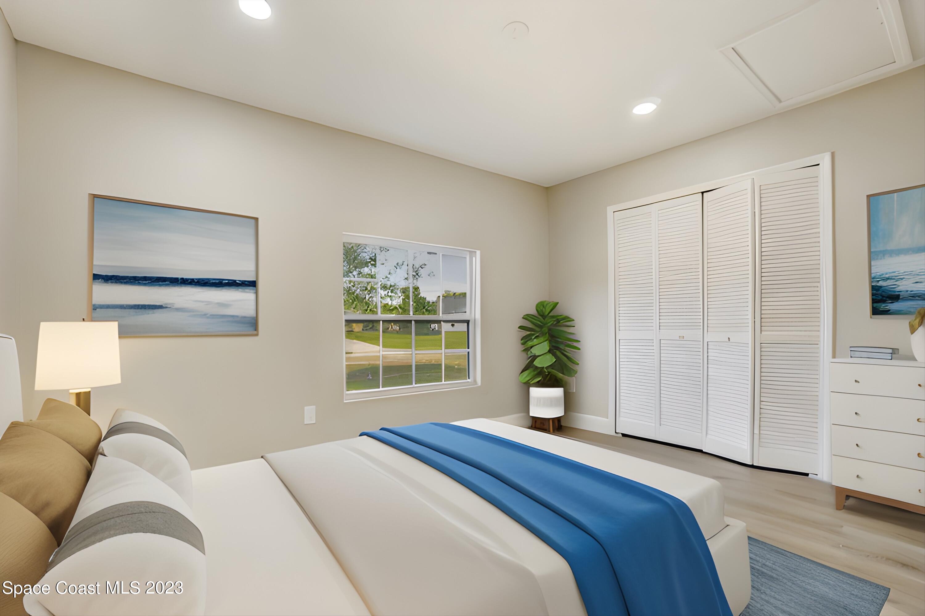 207 Eldron Boulevard Southeast Palm Bay, FL 32909 - Photo 43 of 60 a bedroom with a large bed and a window