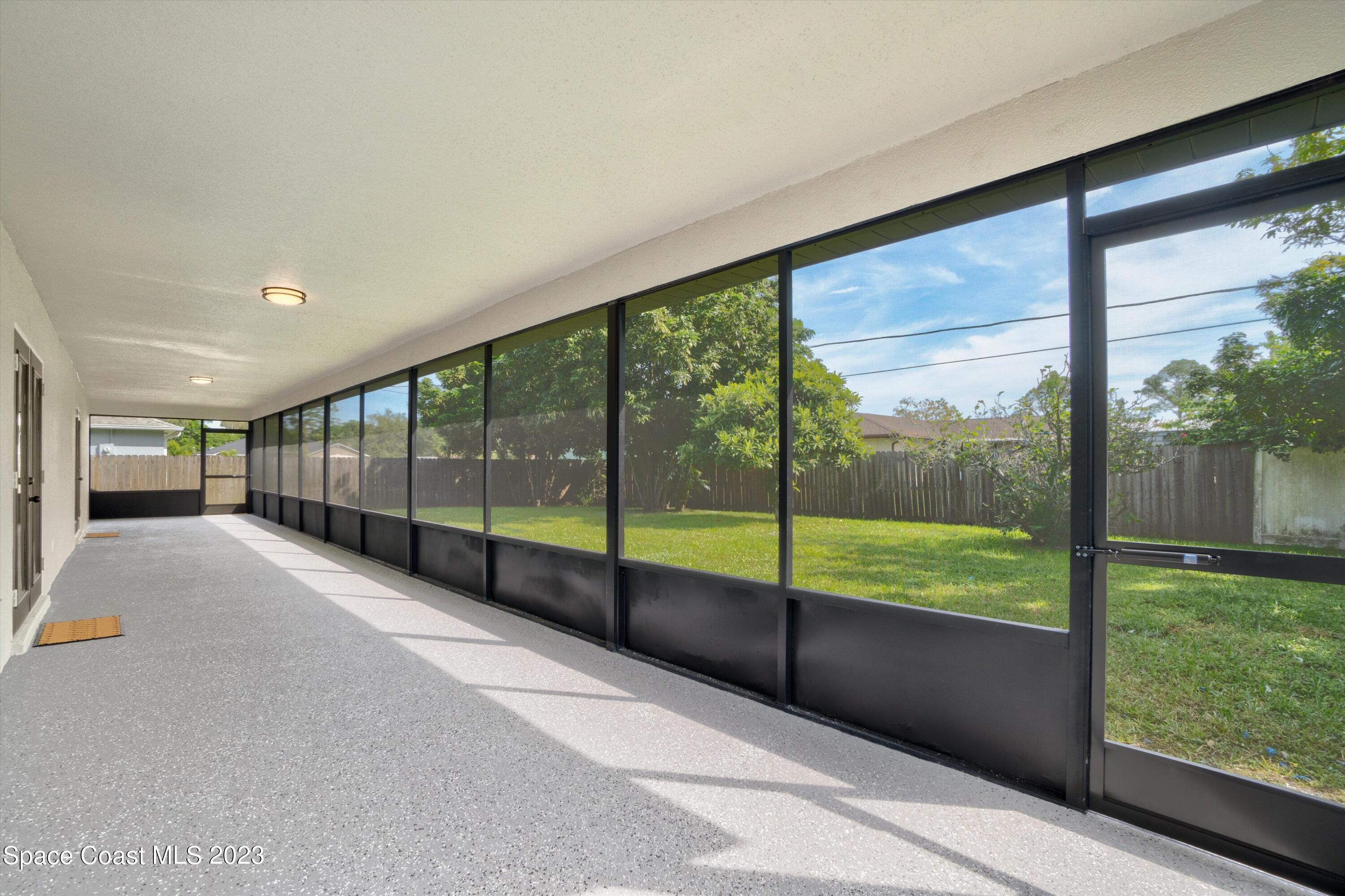 207 Eldron Boulevard Southeast Palm Bay, FL 32909 - Photo 46 of 60 a view of an empty room with windows