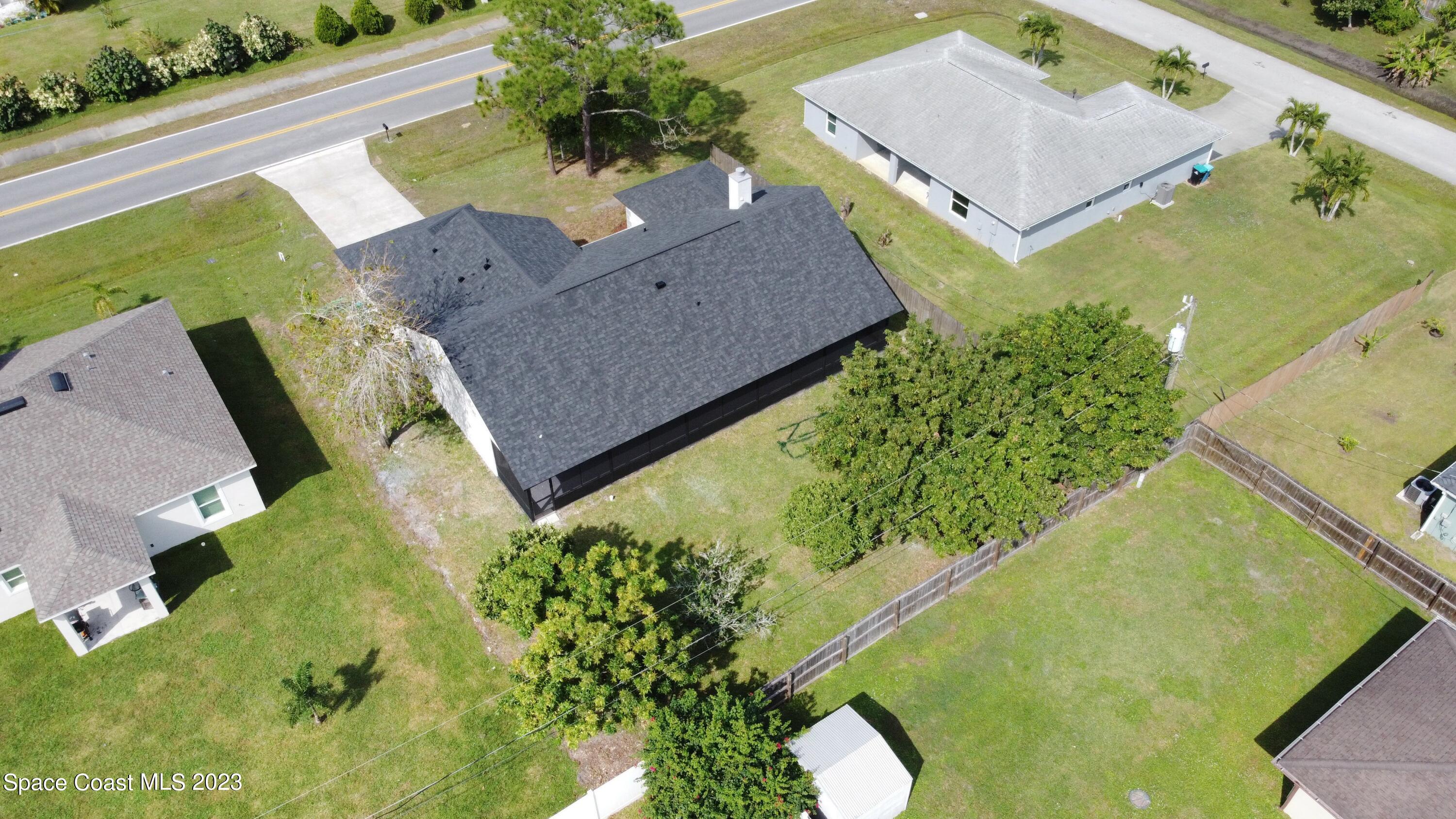 207 Eldron Boulevard Southeast Palm Bay, FL 32909 - Photo 56 of 60 an aerial view of a house with a yard