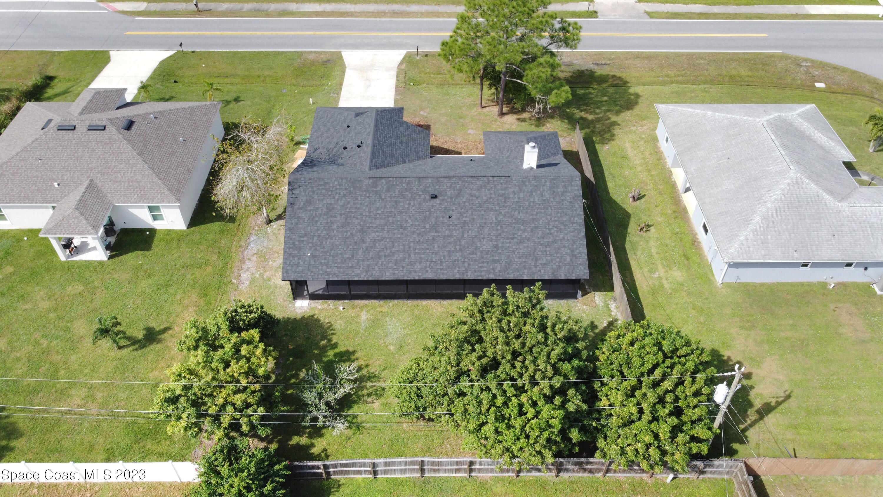 207 Eldron Boulevard Southeast Palm Bay, FL 32909 - Photo 57 of 60 a aerial view of a house with garden space and sitting space