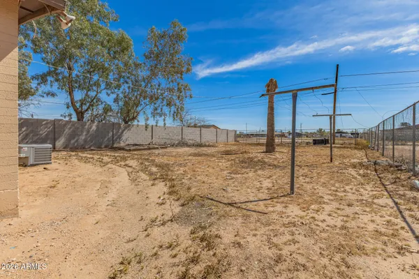 a view of a backyard of the house