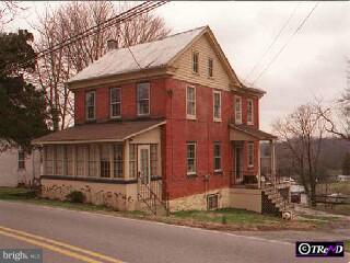 4483 Newark Road Cochranville, PA 19330 - Photo 1 of 1 a front view of a house with a yard
