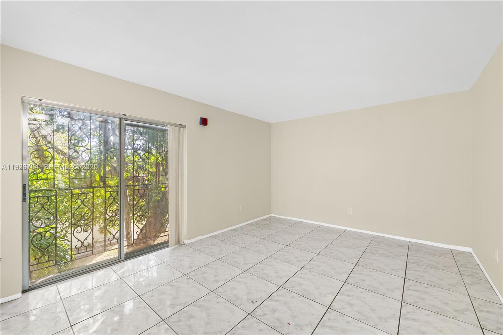 16215 Northeast 18th Court, Unit 212 North Miami Beach, FL 33162 - Photo 11 of 16 a view of an empty room with a window