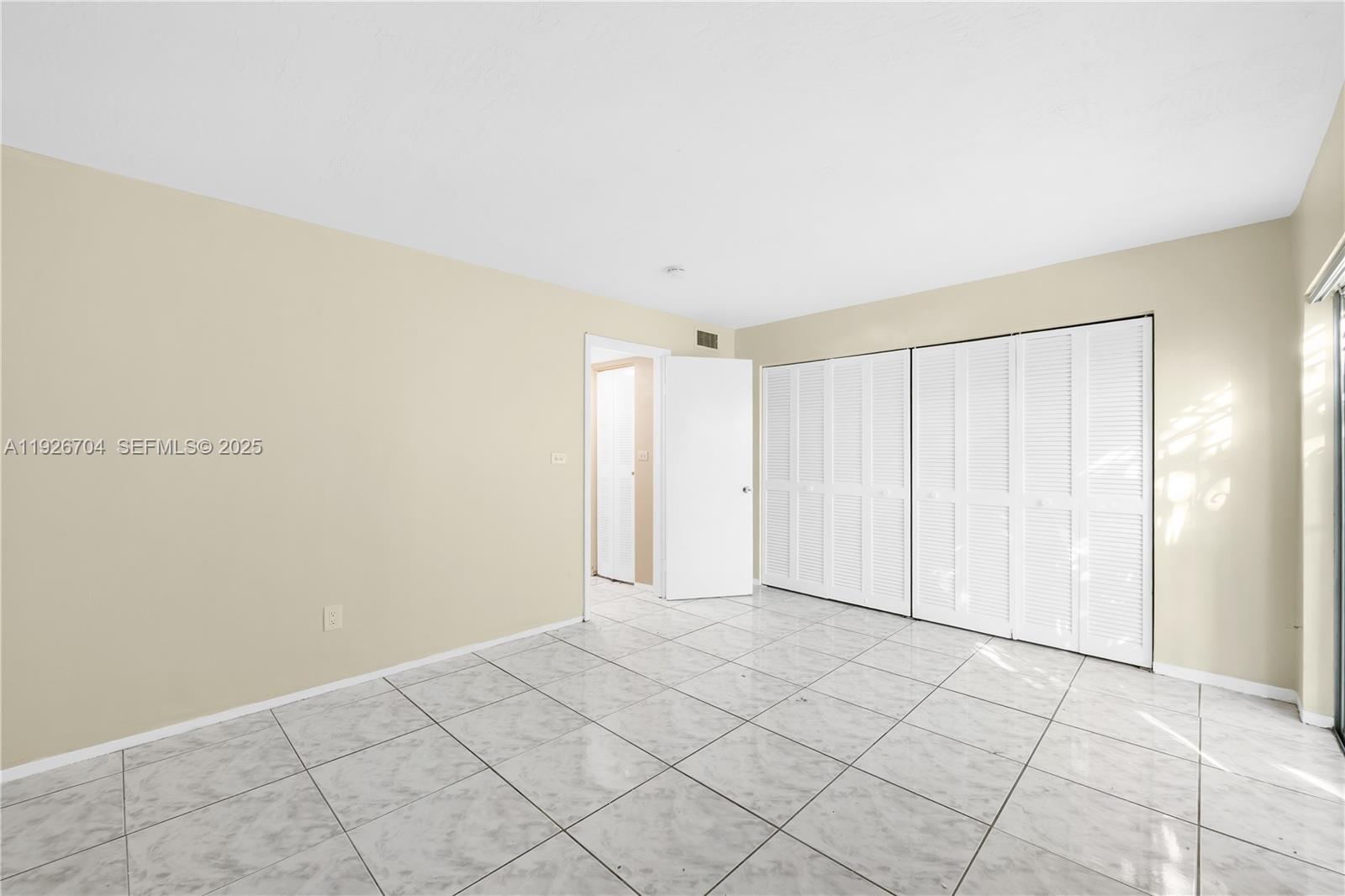 16215 Northeast 18th Court, Unit 212 North Miami Beach, FL 33162 - Photo 12 of 16 a view of an empty room