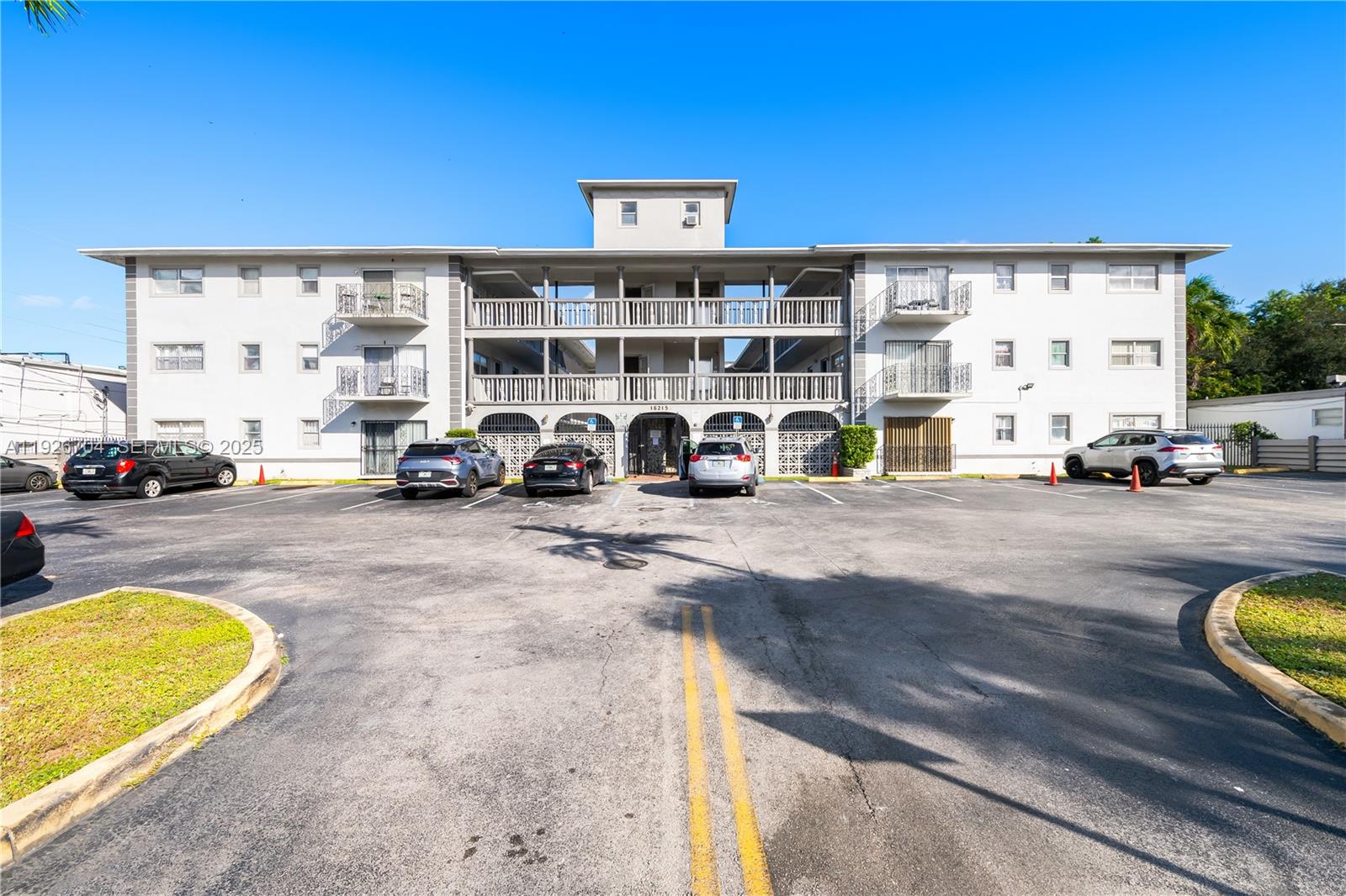 16215 Northeast 18th Court, Unit 212 North Miami Beach, FL 33162 - Photo 15 of 16 a view of building with cars parked
