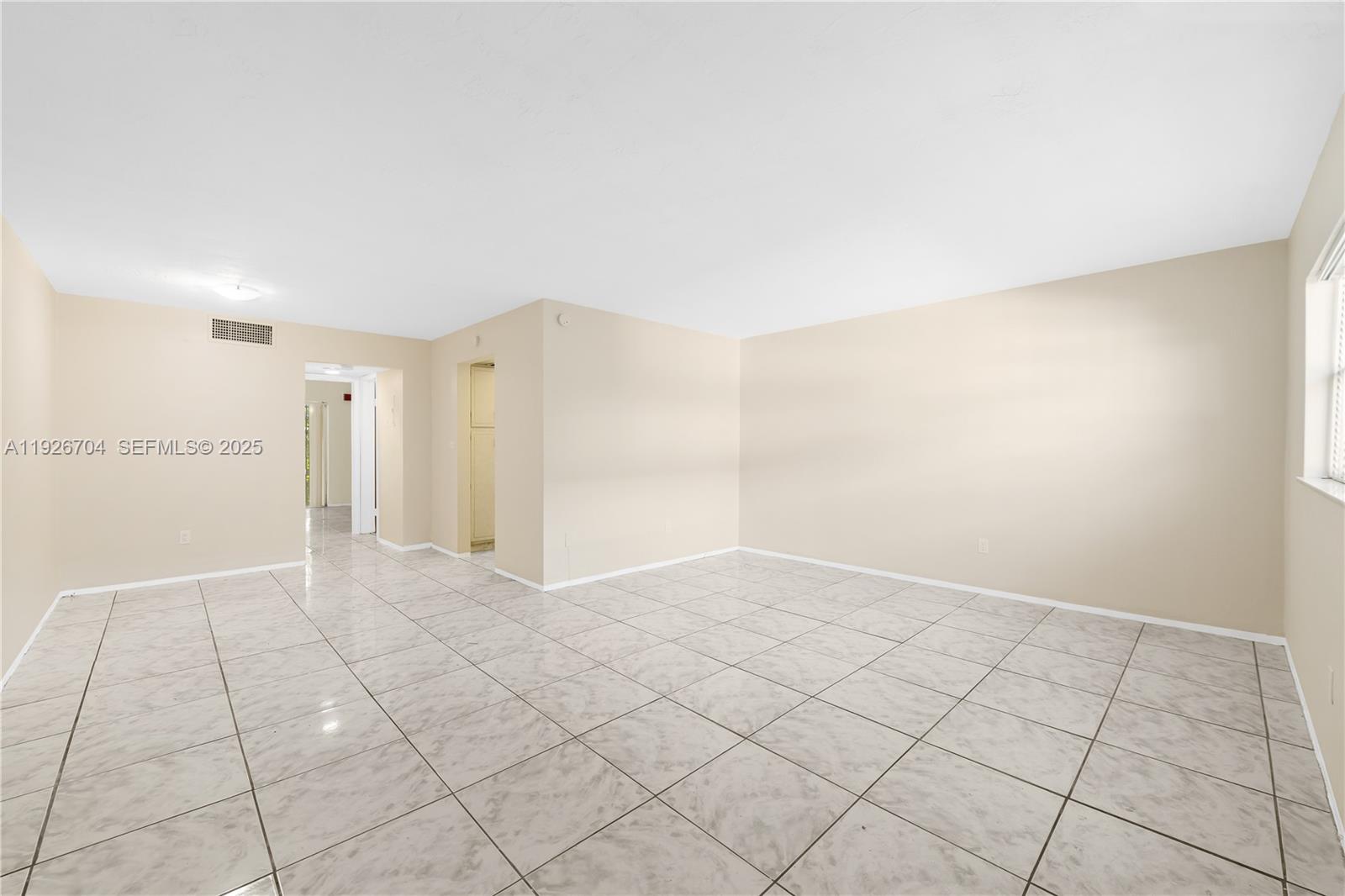 16215 Northeast 18th Court, Unit 212 North Miami Beach, FL 33162 - Photo 2 of 16 a view of an empty room