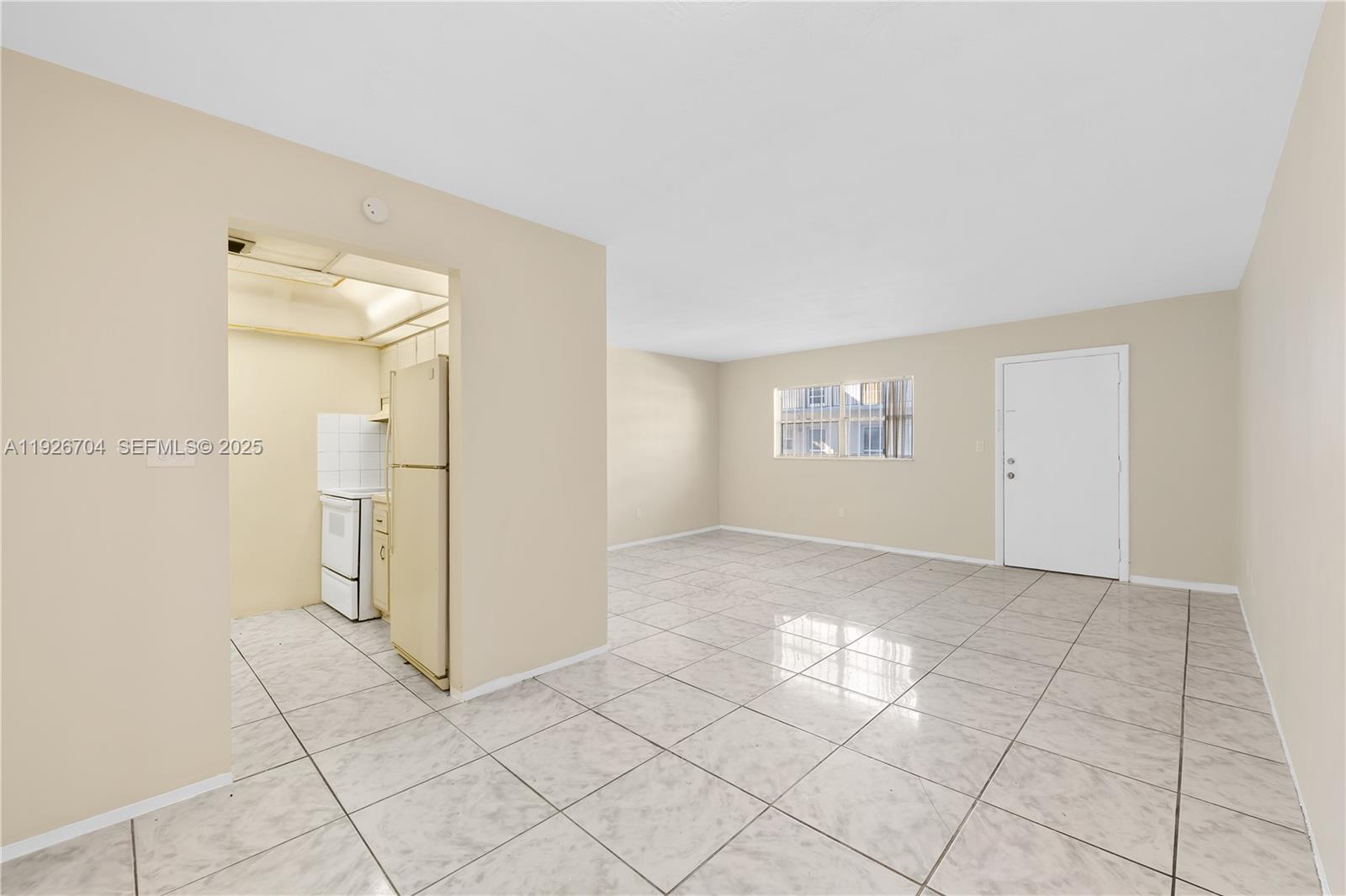 16215 Northeast 18th Court, Unit 212 North Miami Beach, FL 33162 - Photo 4 of 16 a view of an empty room with a window