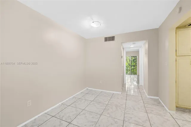 a view of an empty room and window