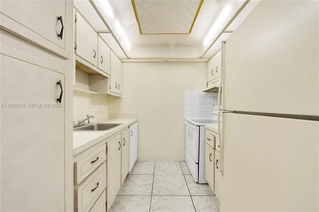 a bathroom with a sink a mirror and a shower