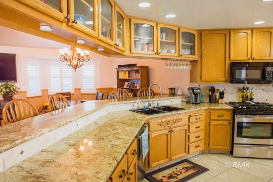 412 Mavis Court Ridgecrest, CA 93555 - Photo 7 of 35 a large kitchen with stainless steel appliances granite countertop a lot of counter space and a sink