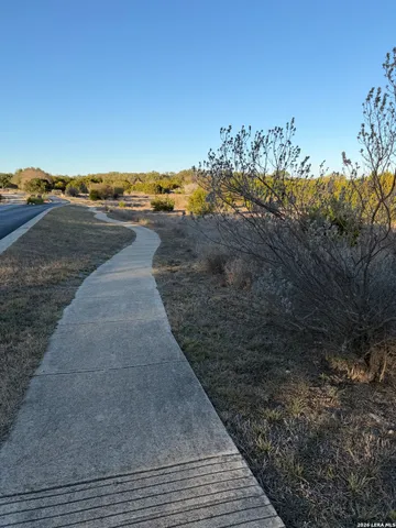 a view of a road with an ocean view
