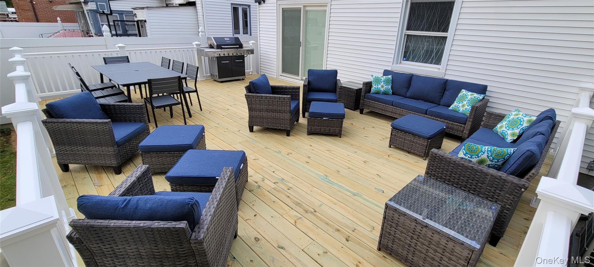 49-54 166th Street Queens, NY 11365 - Photo 14 of 41 a outdoor living space with furniture and a fireplace