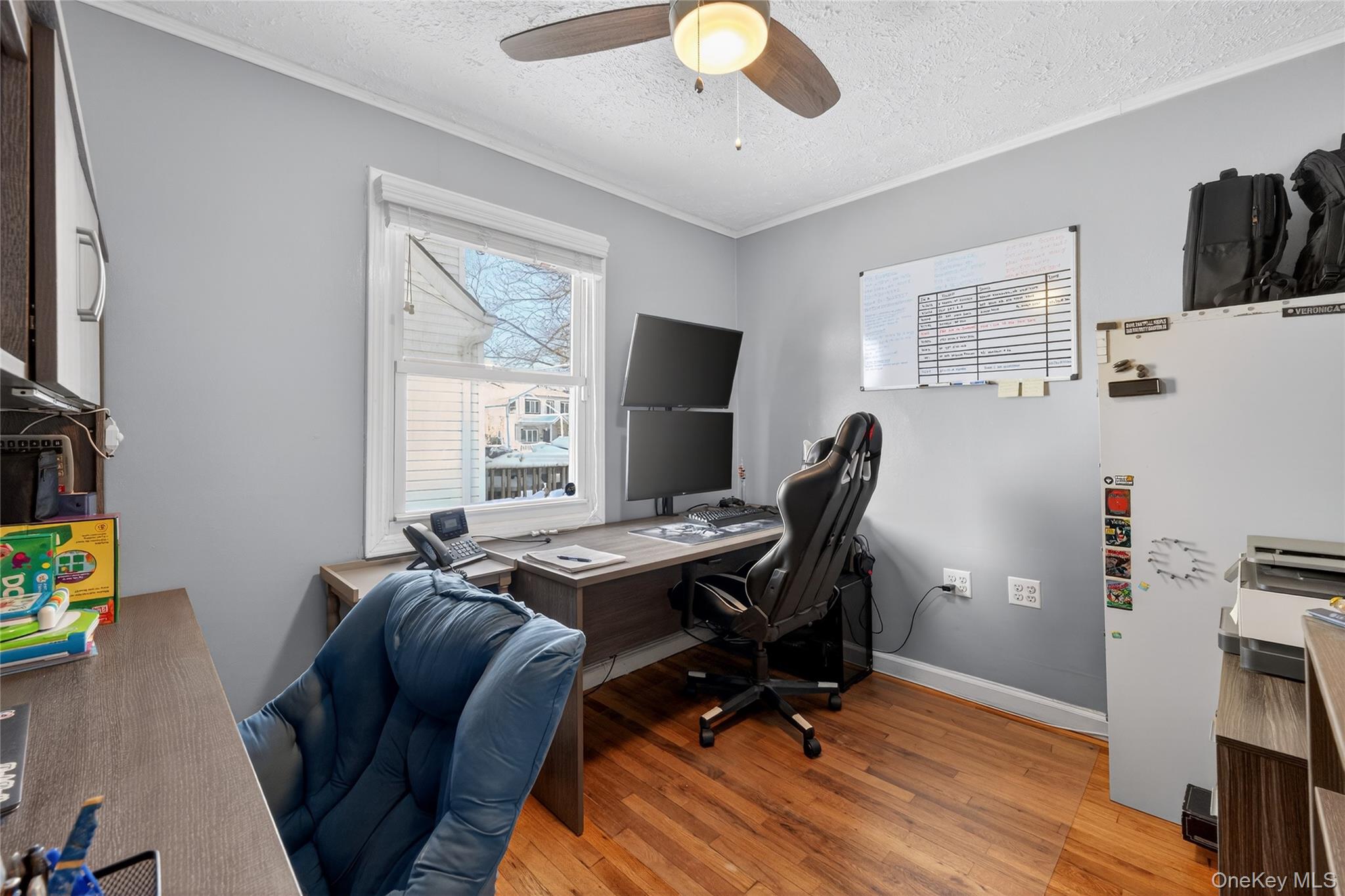 49-54 166th Street Queens, NY 11365 - Photo 18 of 41 a view of a workspace with furniture and a window