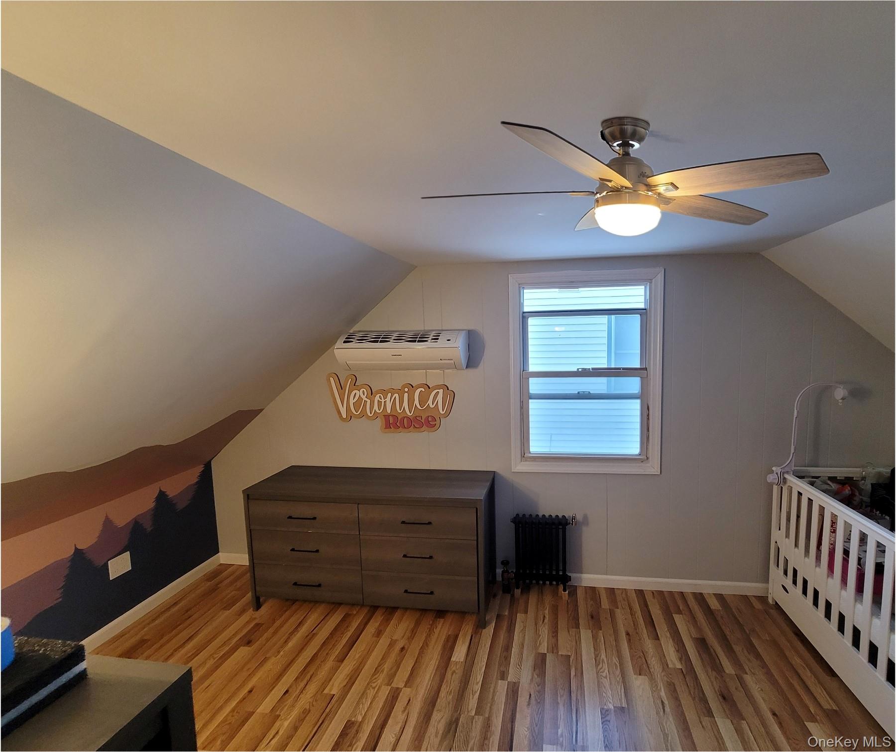 49-54 166th Street Queens, NY 11365 - Photo 30 of 41 a view of a room with furniture and wooden floor