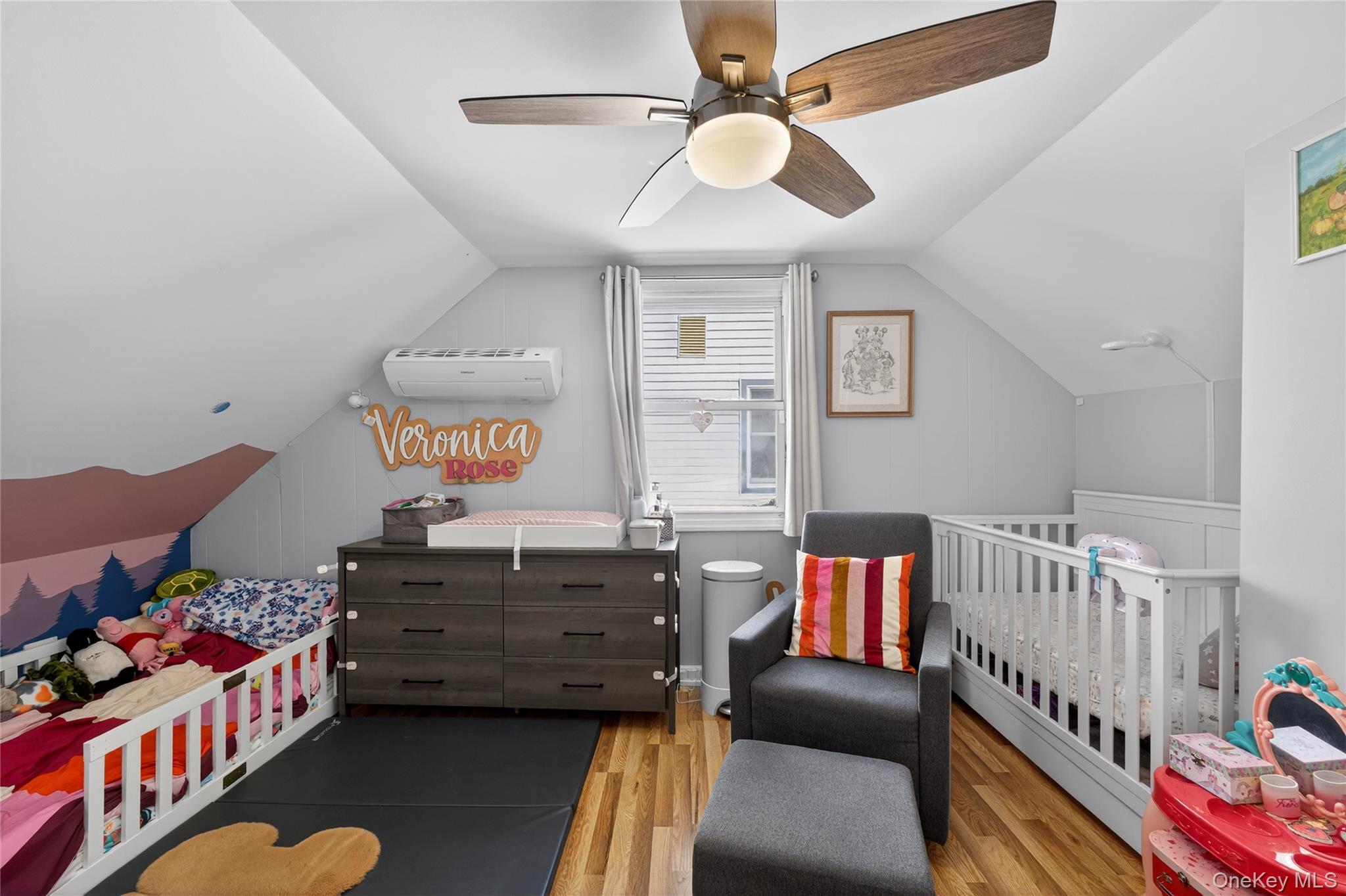 49-54 166th Street Queens, NY 11365 - Photo 31 of 41 a living room with furniture and a baby crib