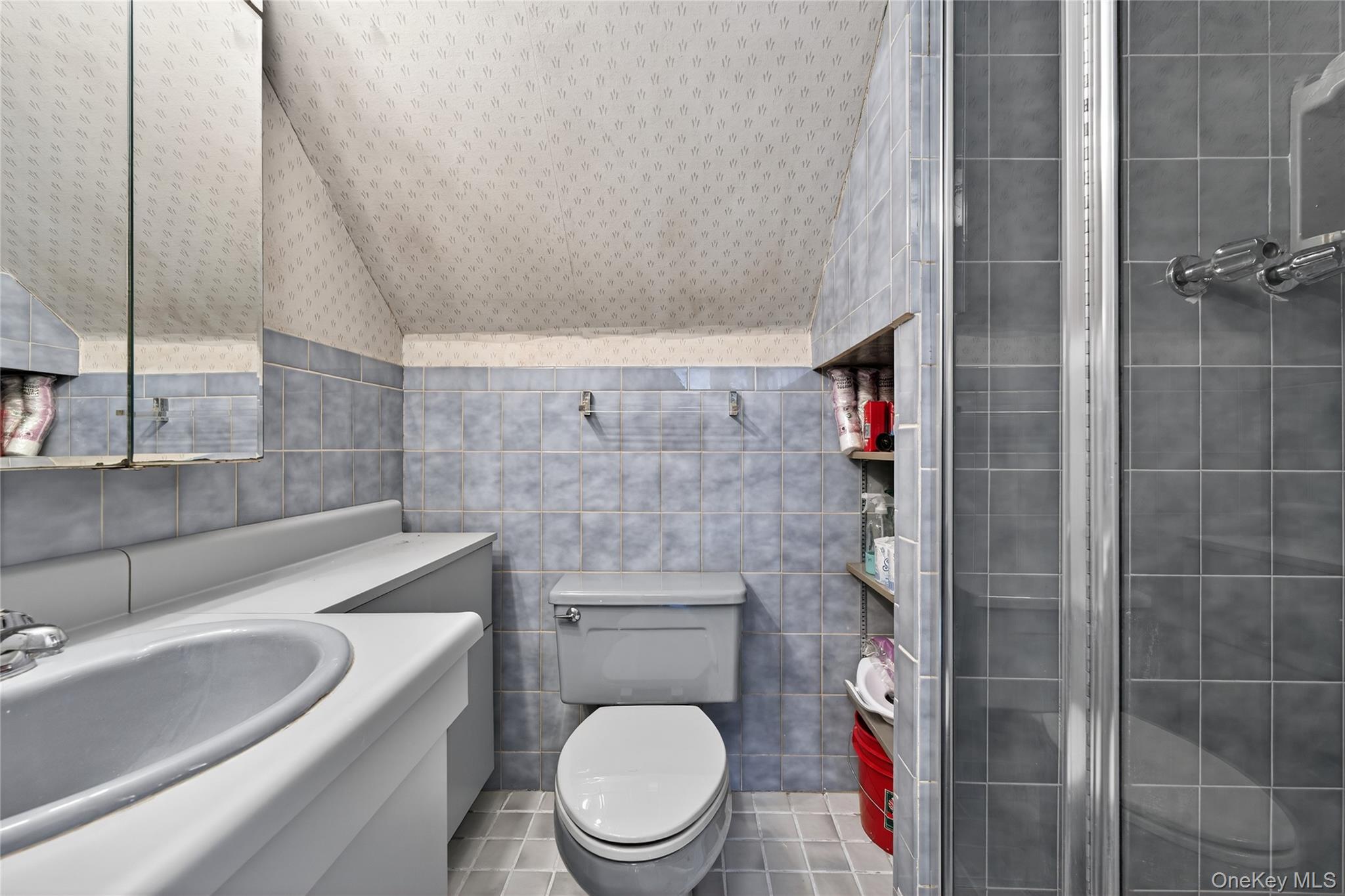 49-54 166th Street Queens, NY 11365 - Photo 33 of 41 a bathroom with a toilet a sink and shower