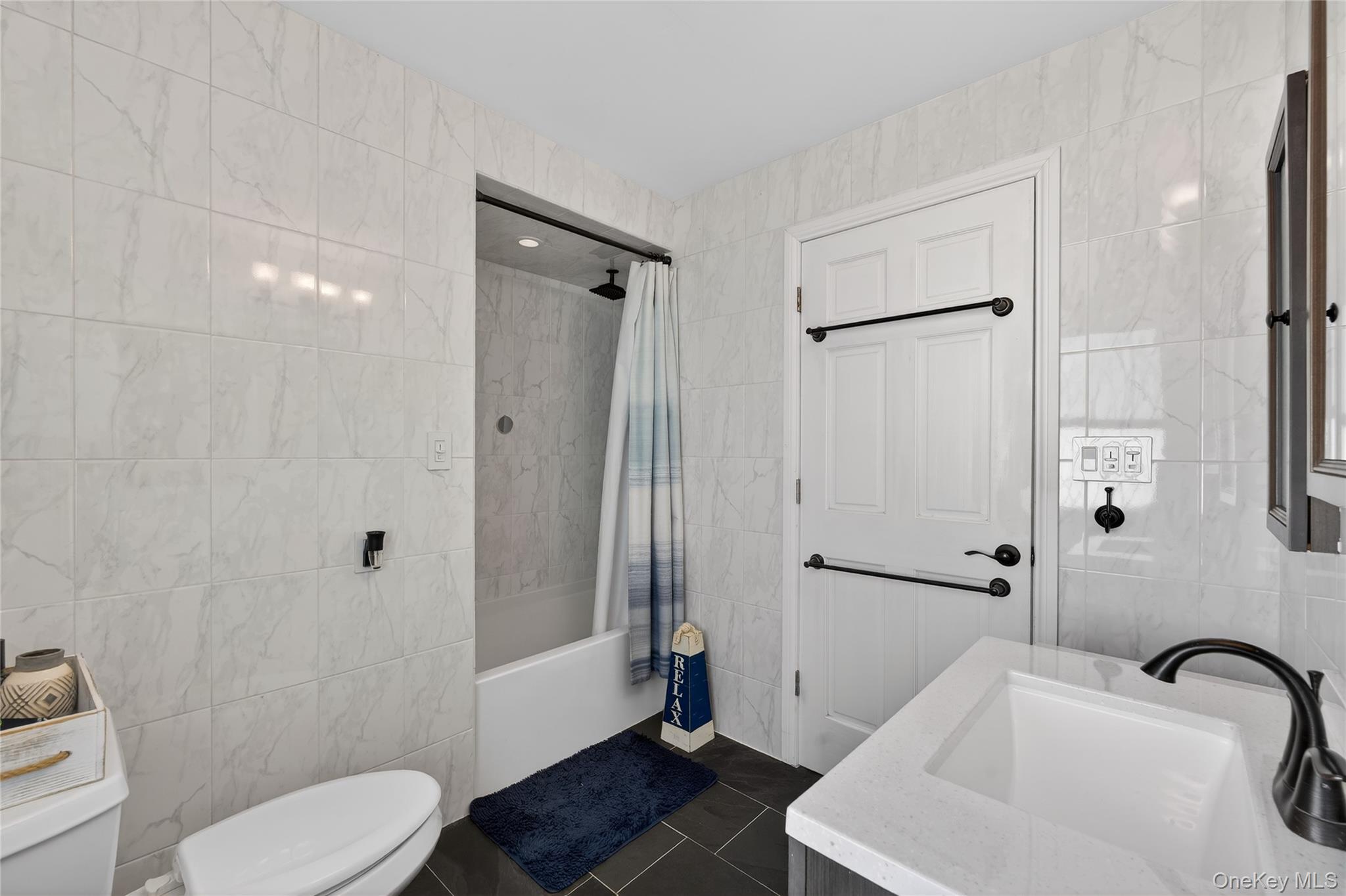 49-54 166th Street Queens, NY 11365 - Photo 34 of 41 a bathroom with a sink toilet and shower